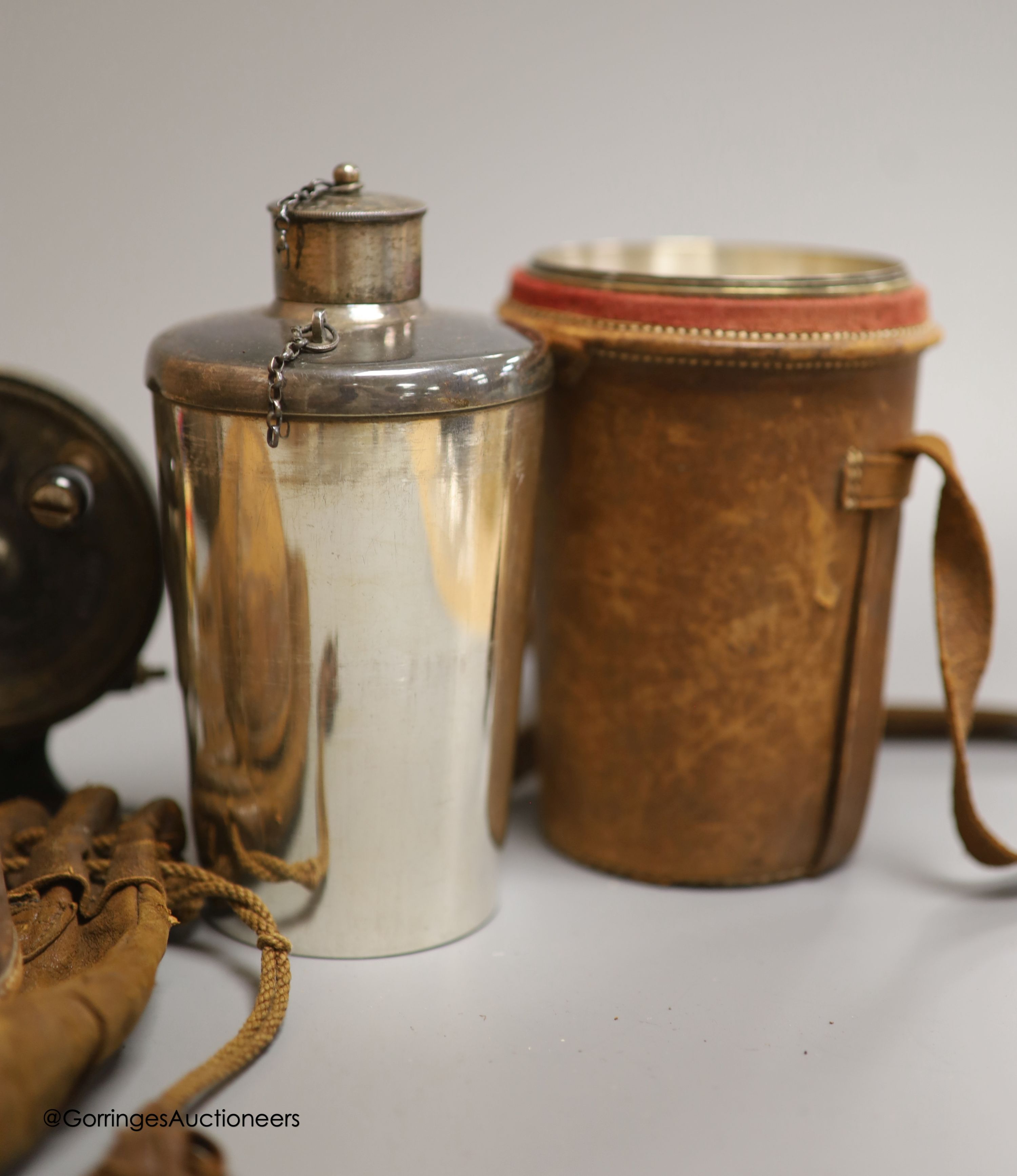 A leather cased flask and cups, various WWI and WWII medals, binoculars and a fishing reel